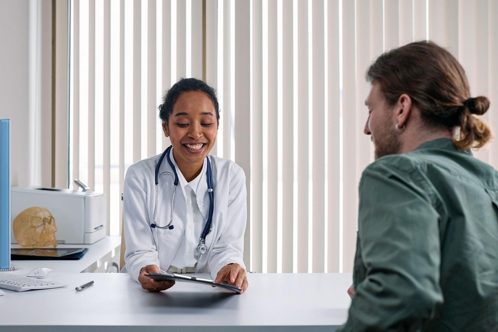A doctor talks a patient through what happens next